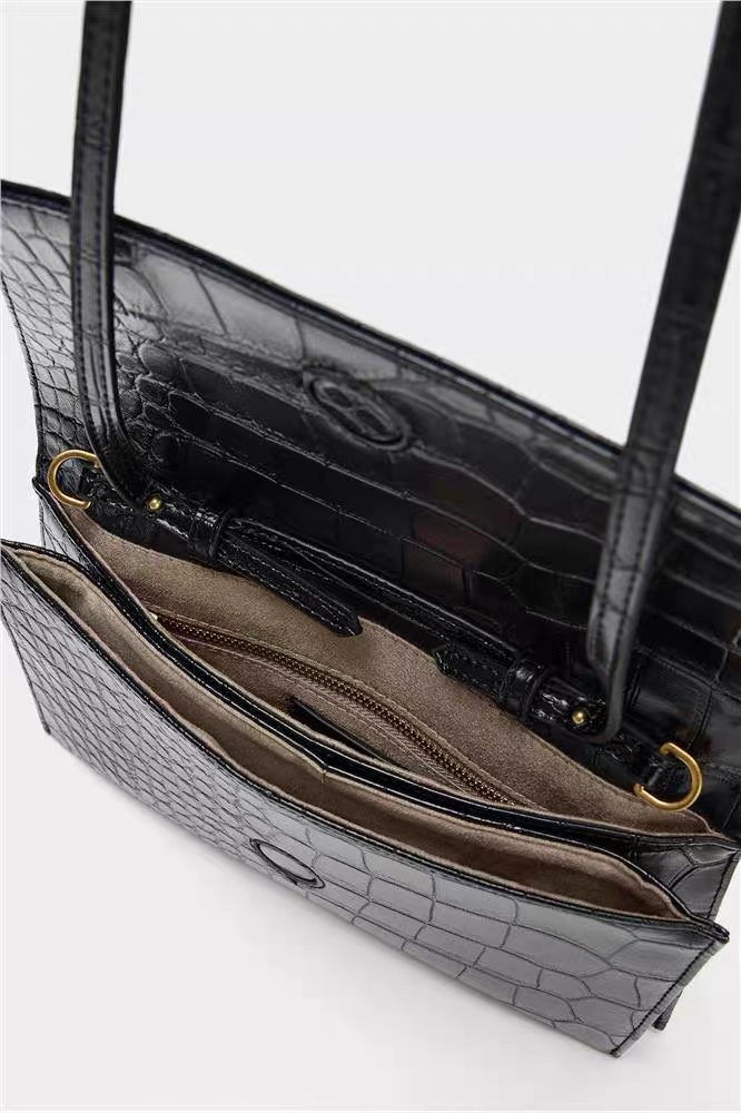 Flip-top crossbody bag