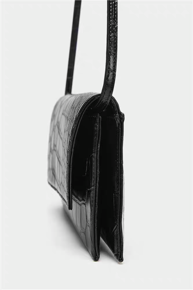 Flip-top crossbody bag